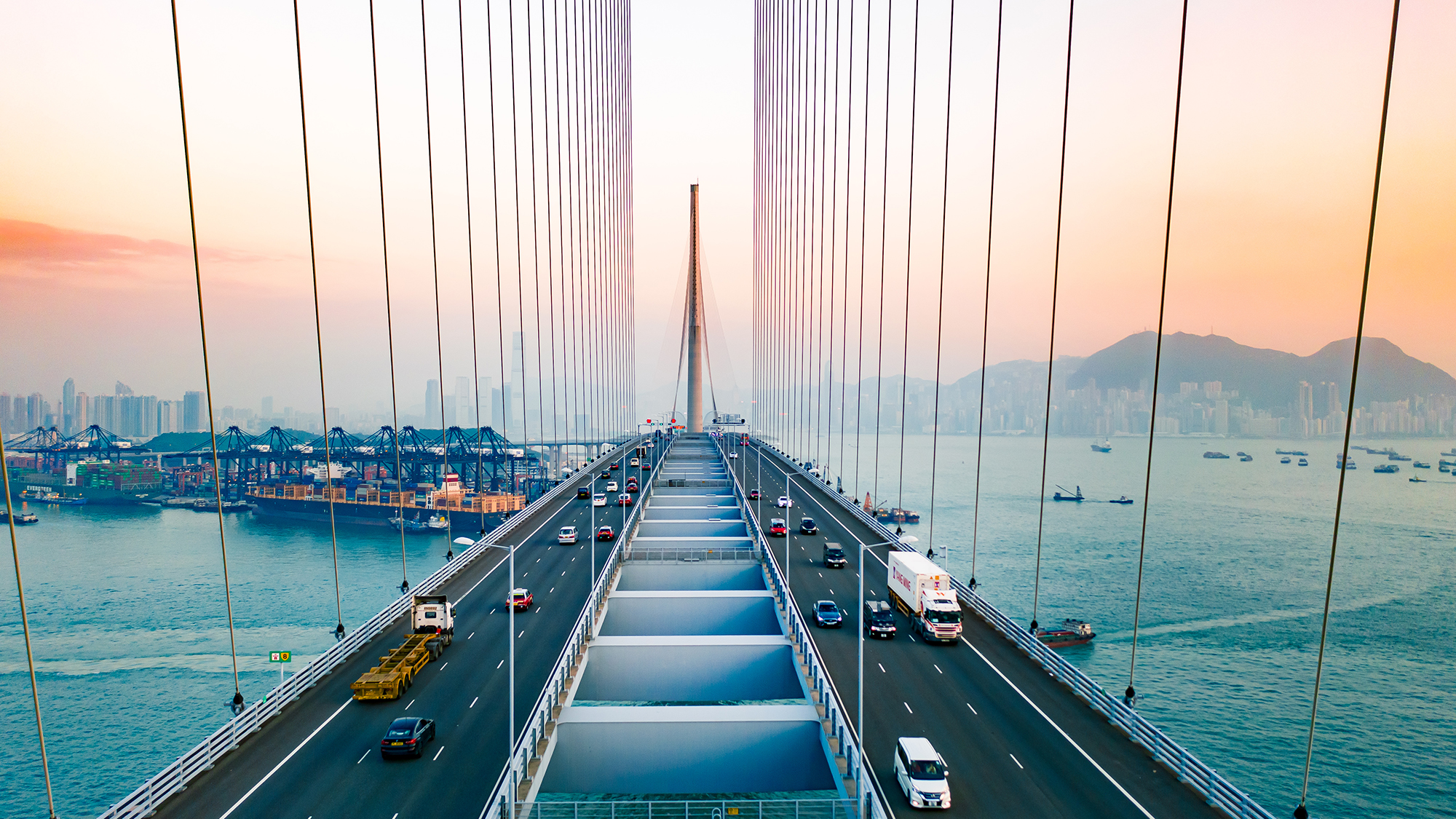 Drone view of Stonecutters Bridge and the Tsing sha highway at sunset
