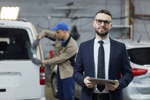 Businessman In Auto Service Center Portrait