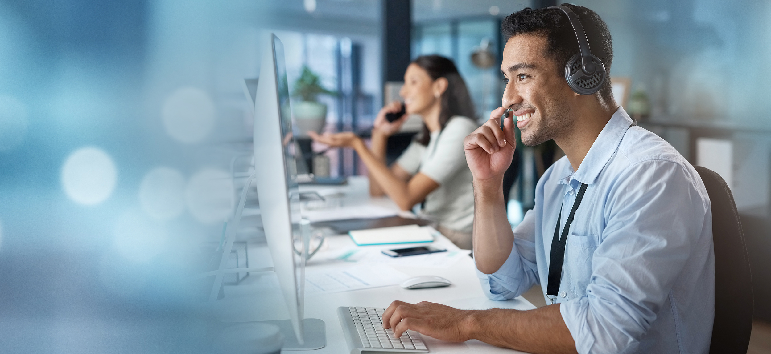 Contact us, mockup or happy consultant in a call center helping, talking or networking online in office. Smile, man or insurance agent in communication or conversation at customer services or sales