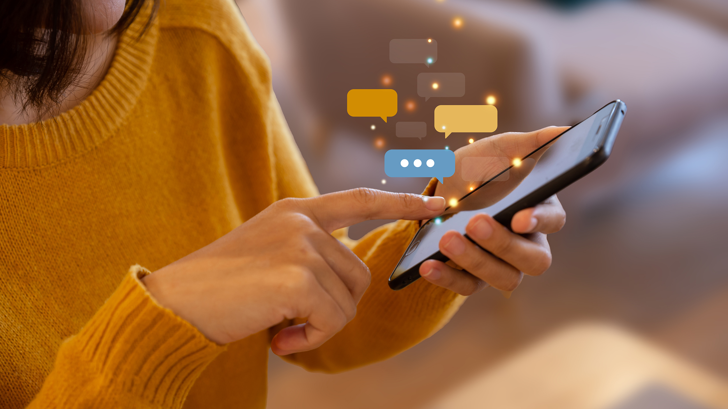 Hand of young woman using smartphone for chat and communication