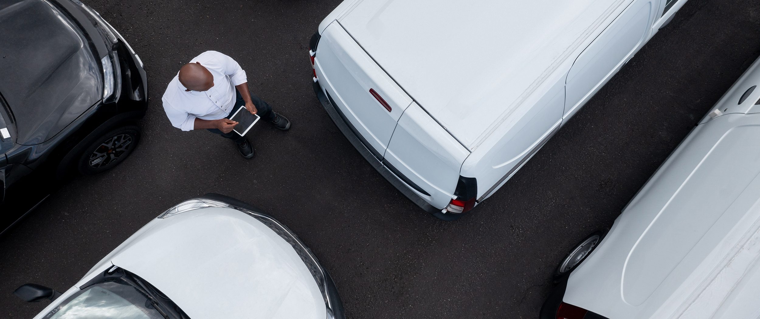Salesman working at the dealership selling cars