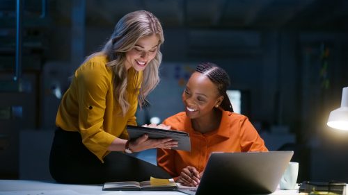 Business people, teamwork and tablet for night research, data analytics results, multimedia comparison and planning. Professional women or manager with digital technology, happy report and proposal