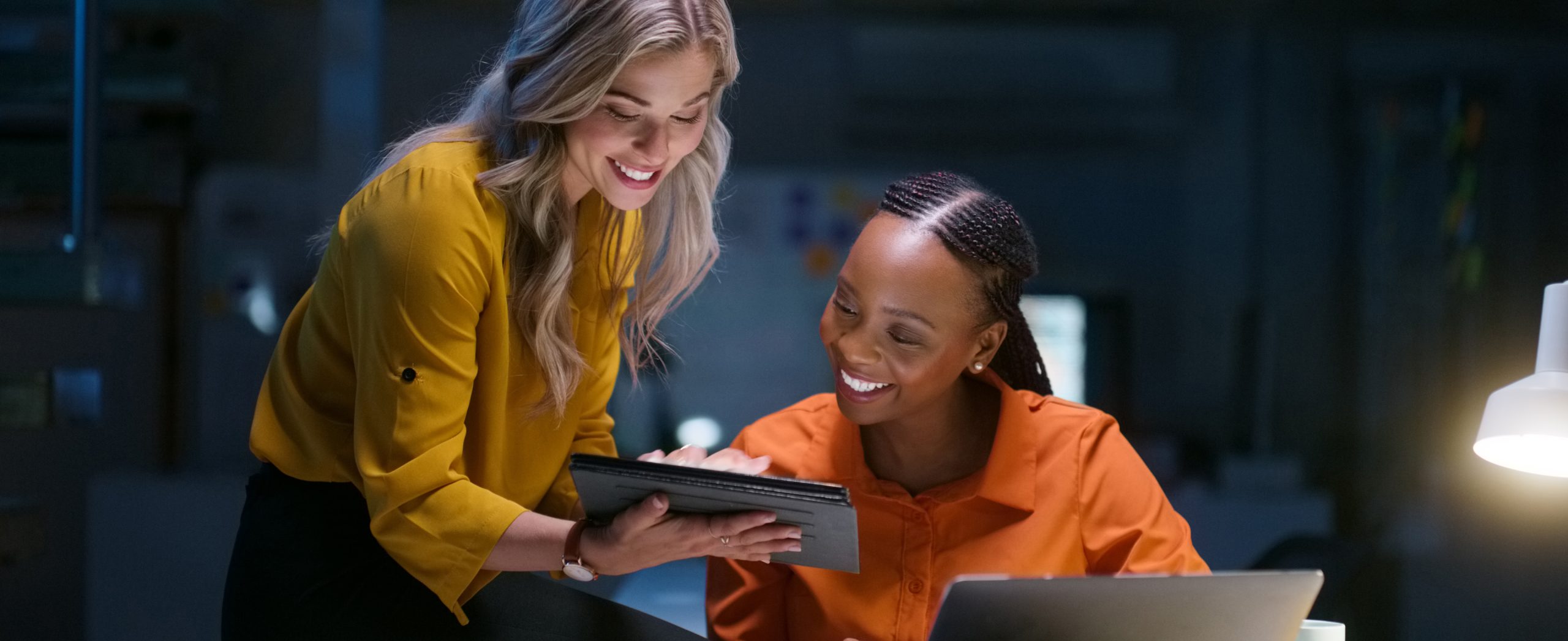 Business people, teamwork and tablet for night research, data analytics results, multimedia comparison and planning. Professional women or manager with digital technology, happy report and proposal