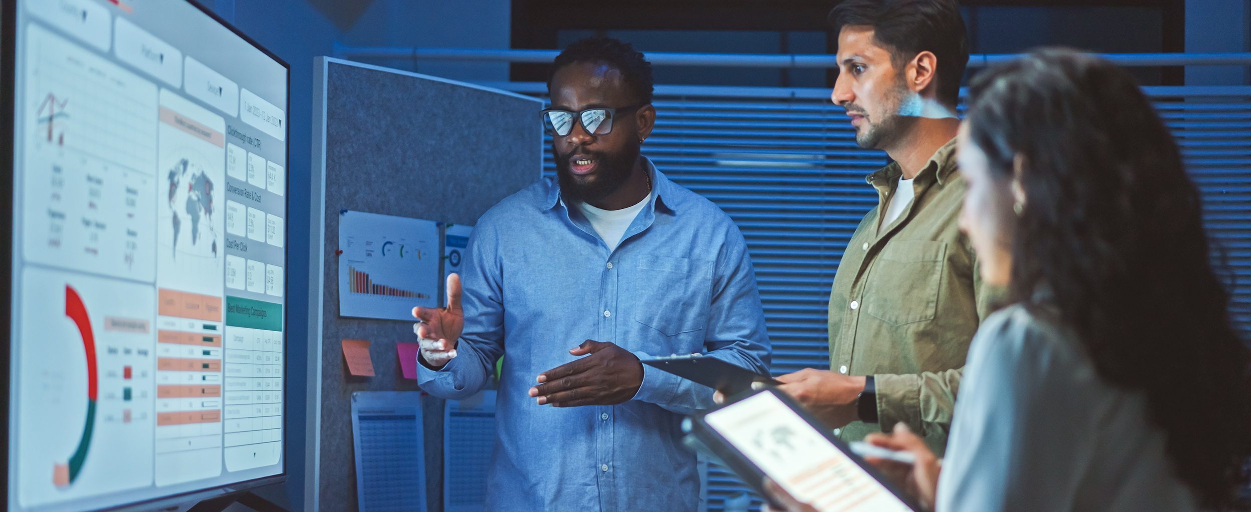 Data analytics team meeting at night.